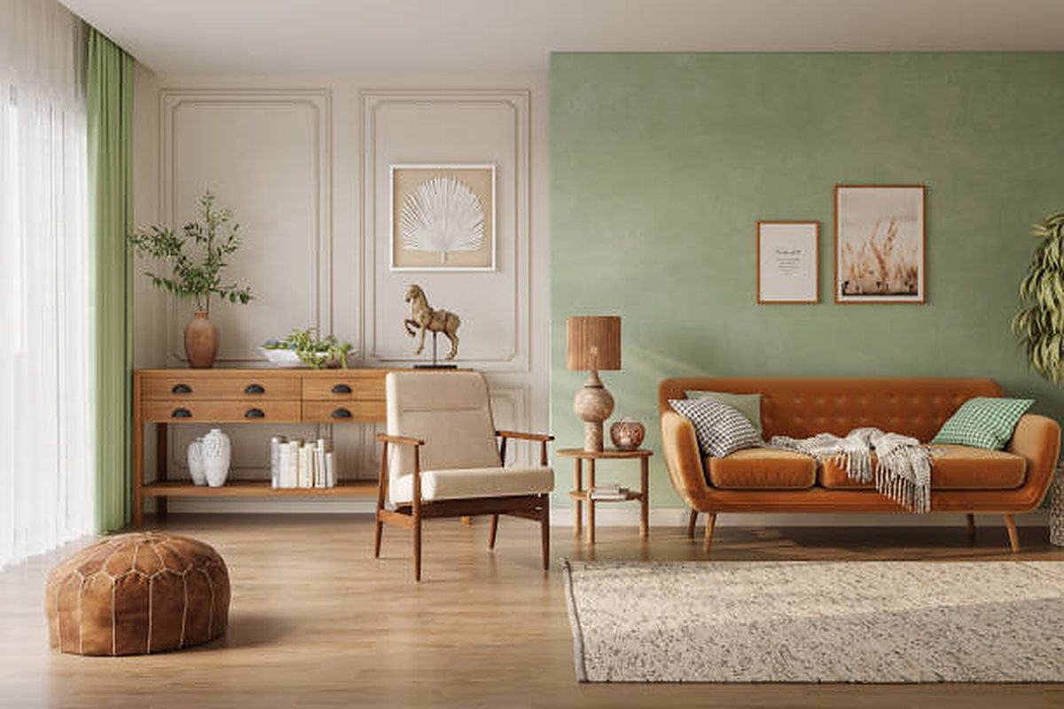 Retro living room, sage green wall and cognac sofa